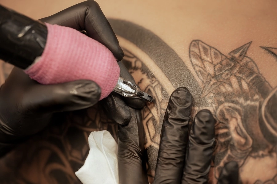 Tattoo artist working in a sterile environment